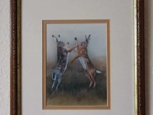 Two hares engaged in a spirited boxing match, beautifully captured in the Robert E Fuller, 1993 Boxing Hares artwork.