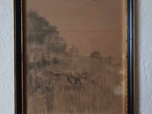 A black and white framed drawing of a field.