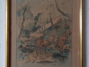 A framed painting of a deer in a stream.