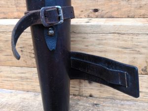 A Hunting Saddle Flask Dark Tan holder with a leather strap.