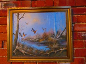 Oil on Canvas 'Ducks Landing' Painting: The product is an oil on canvas painting of ducks landing in a pond.